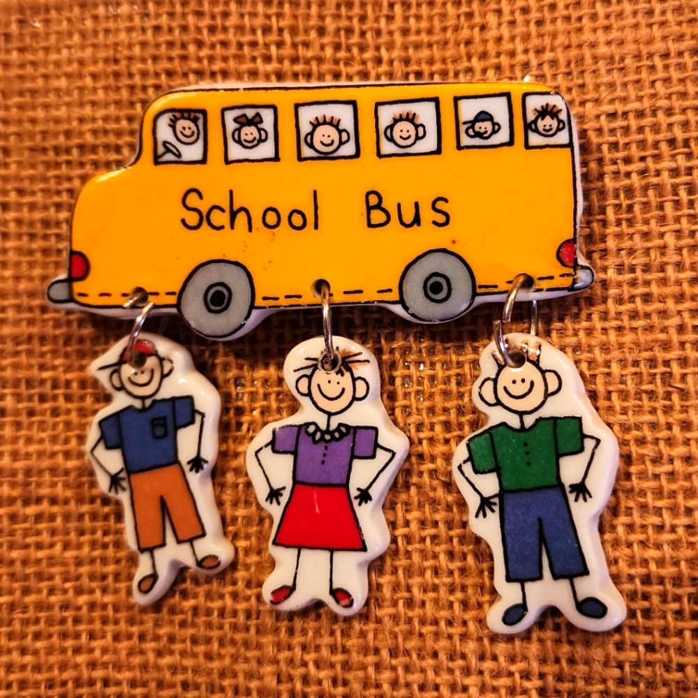 School Bus Brooch with 3 kids hanging down. Pin